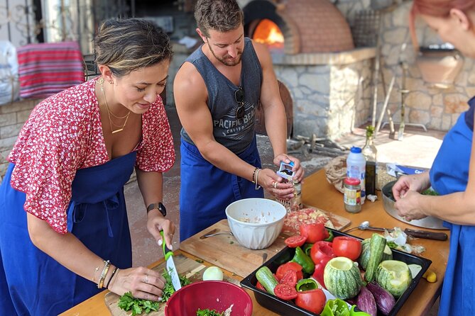 Chania Cooking Class-The Authentic Enjoy traditional Cretan meal - Appetizers first on your plate: Ntakos, tzatziki, and Cretan salad
