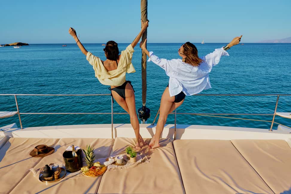 Hersonissos: Sunset Catamaran Cruise with Snacks and Drinks - Agios Georgios Bay Water Time: Swim, Snorkel, SUP, and Fishing Gear