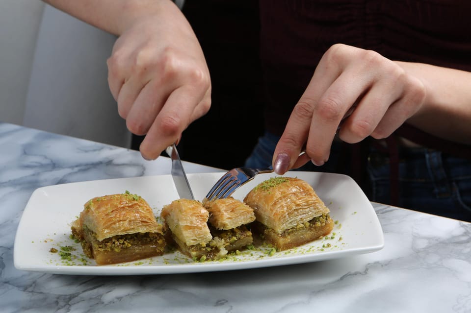 Rethymno Old Town: A Traditional Cretan Food Tour - Iroon Politechniou Square: Wine Pairings and Familiar Crete in a Pretty Setting